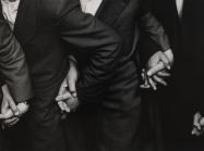Ken Heyman black and white photograph of four sets of hands holding eachother