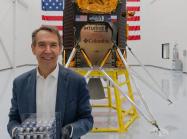 Jeff Koons with his miniature moon sculptures. Jeff Koons.