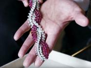 A piece of jewelry is shown in an open palm