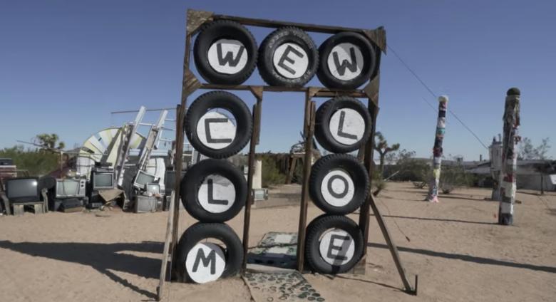 Welcome sign made of tires at the Purifoy Outdoor museum