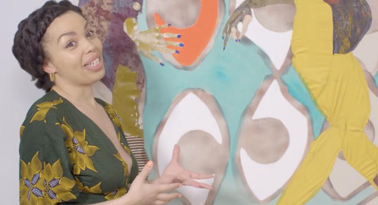 Emma Dabiri talks in front of painting
