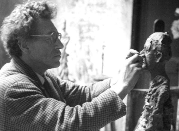 Alberto Giacometti in his studio in Montparnasse, Paris, photographed by his wife Annette.