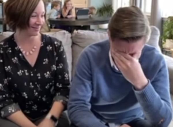 Beeple on couch with woman, he is in disbelief