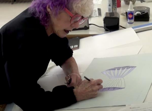 Judy Chicago in her studio working on paper