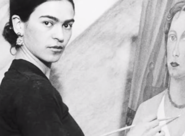 Frida Kahlo working on a painting