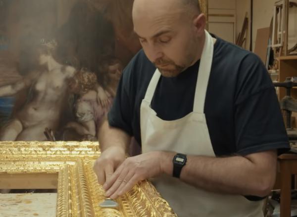 craftsman works on masterpiece frame
