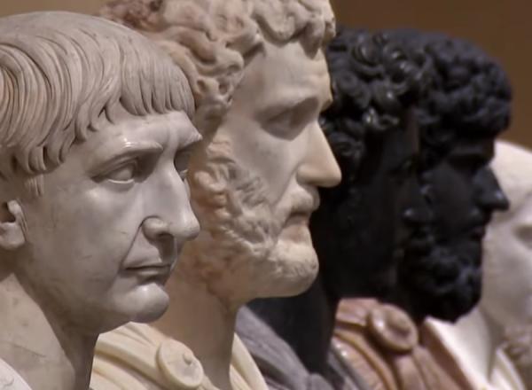 a line of of marble busts receding into the distance. 