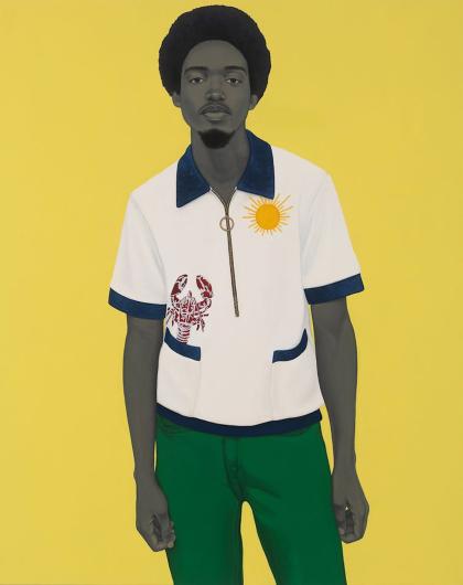 man stands in front of yellow backdrop