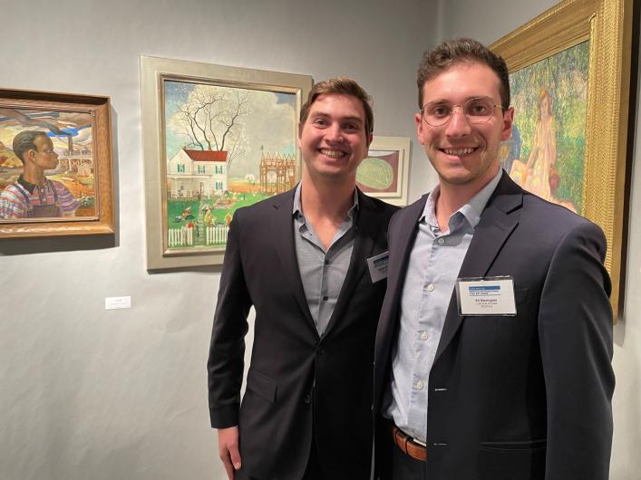 gallery booth art dealers smiling