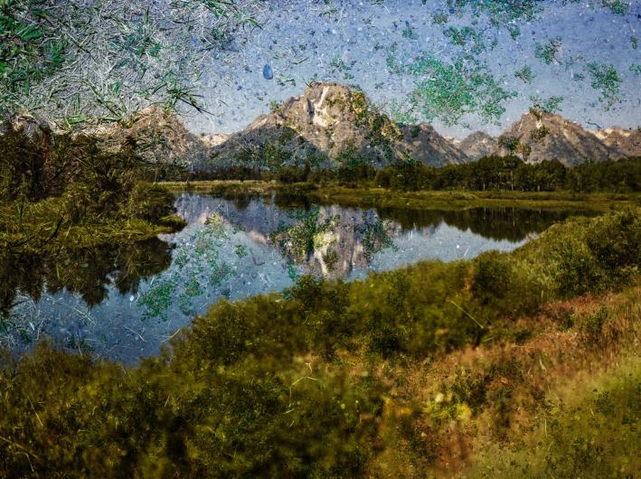 smudgy photograph of the grand tetons and lake